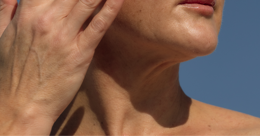 Women using Lust Minerals skincare down her neck