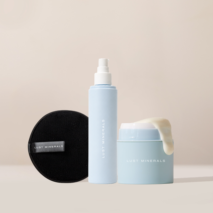 Lust Minerals skincare products including a spray bottle, round container, and jar on a beige background.