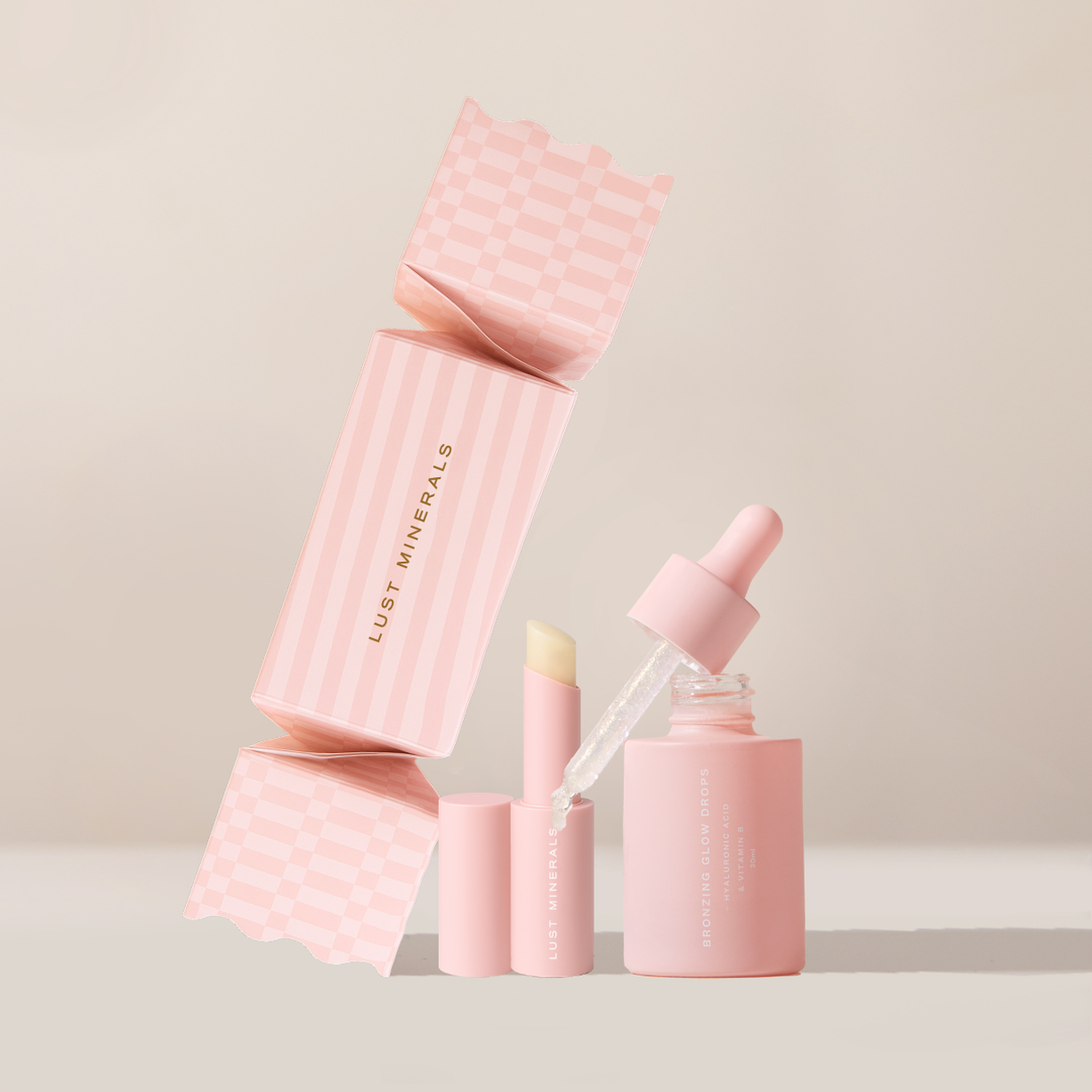 Pink skincare products with 'Lust Minerals' branding on a light background