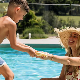 SNDY SKN SPF50 Face & Body mother by pool with son 