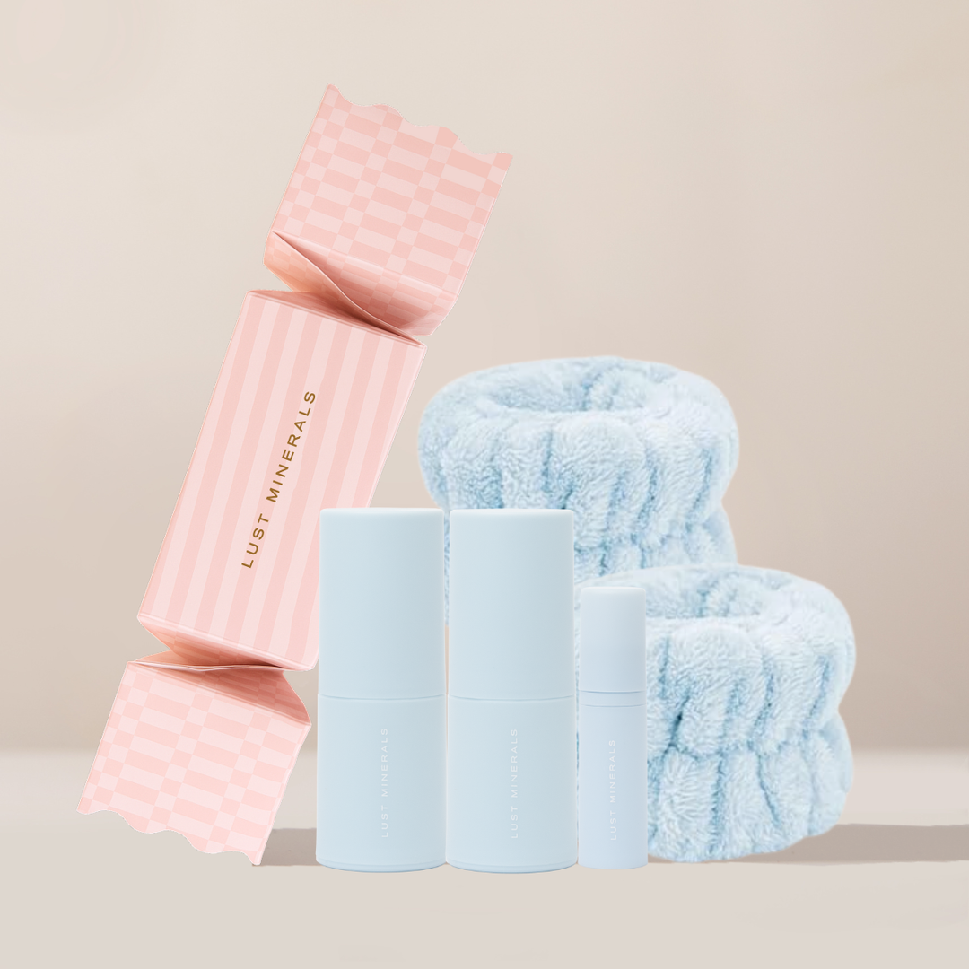 Pink and blue towel sets with 'Lust Minerals' branding on a beige background