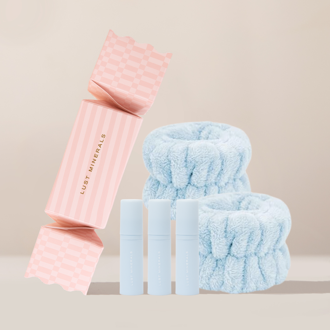 Pink and blue hair accessories on a beige background