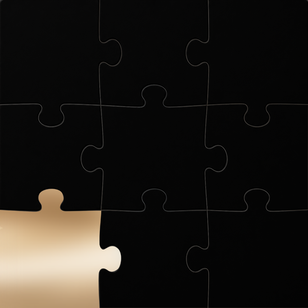 A black jigsaw puzzle with a single gold puzzle piece missing in the bottom-left corner, shown on a black background.